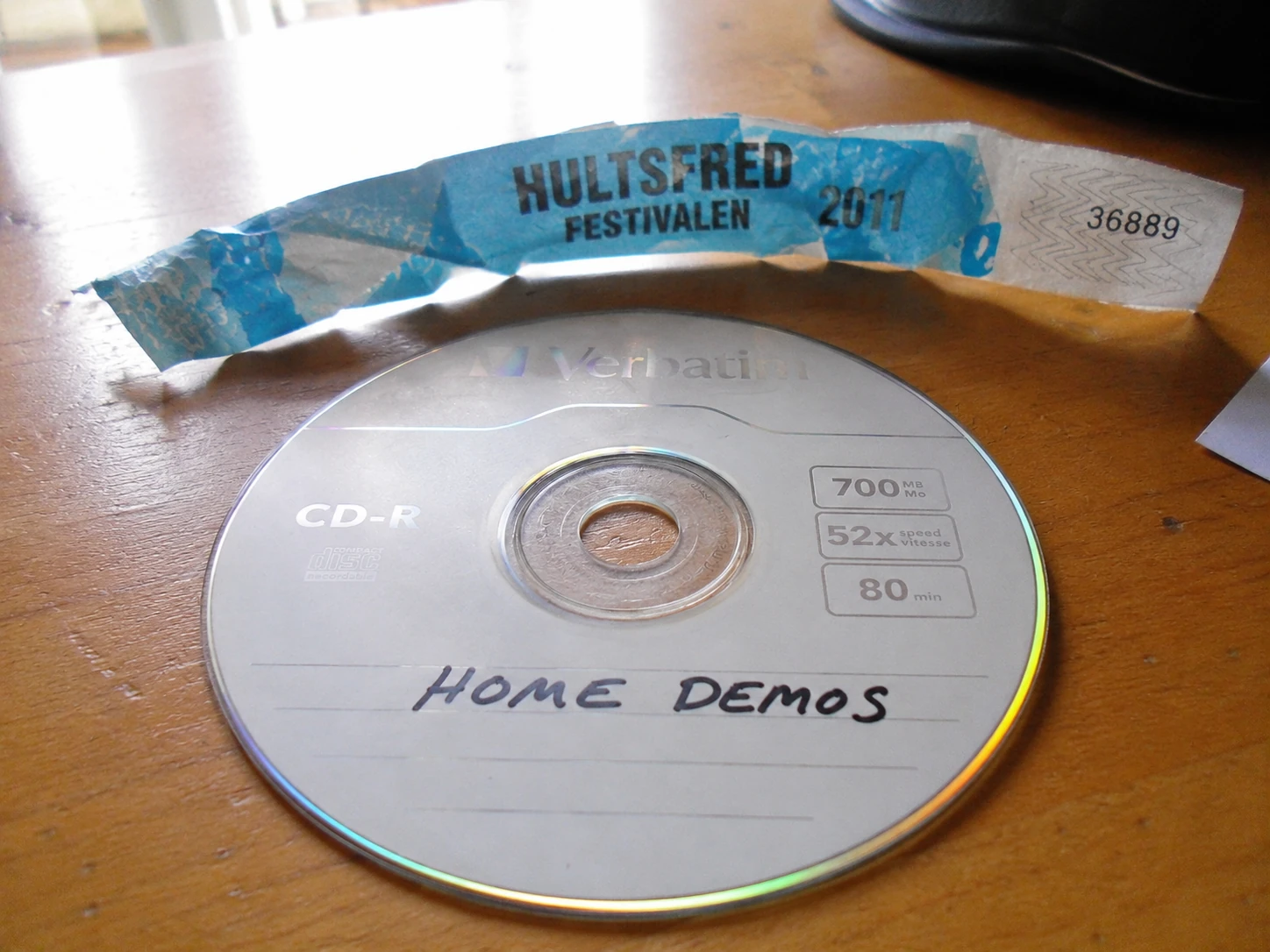 Hultsfred / Home Demos: A wristband, a CD-R, and one mix that probably lived in a glove compartment for three months.